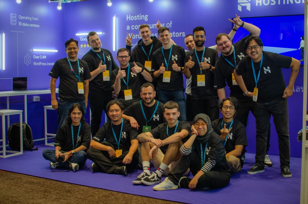 Members of the Hostinger team at the Hostinger booth at WordCamp Asia 2023