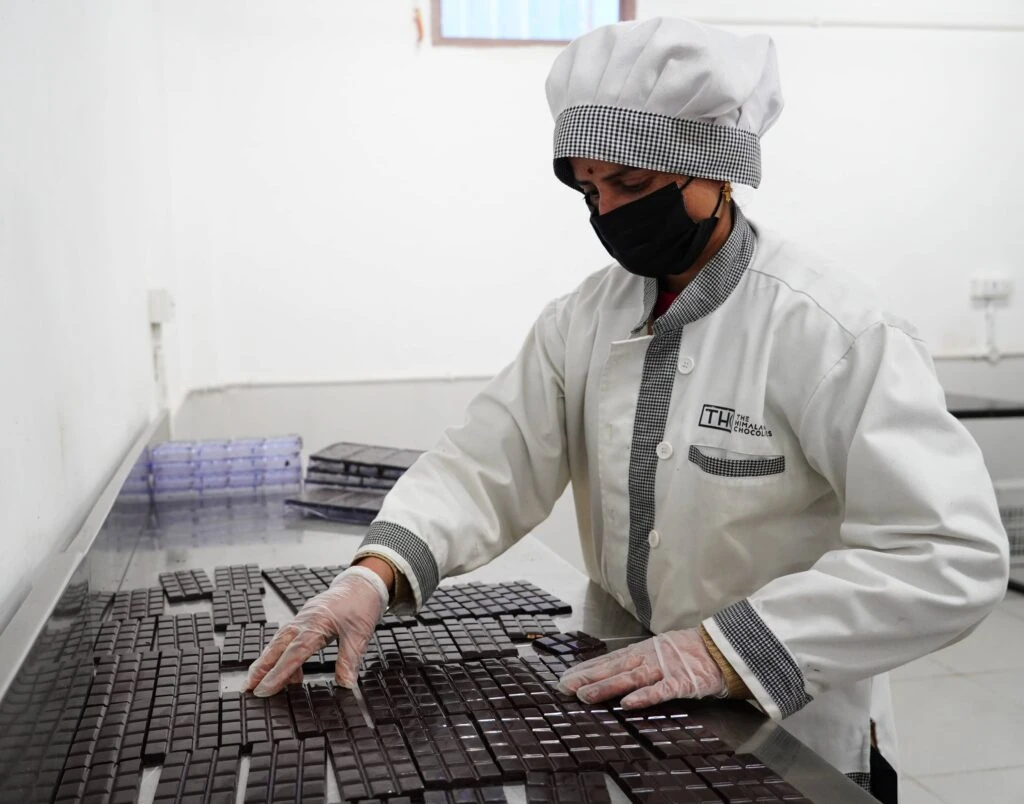 Woman sorting chocolate at The Himalayan Chocolate factory