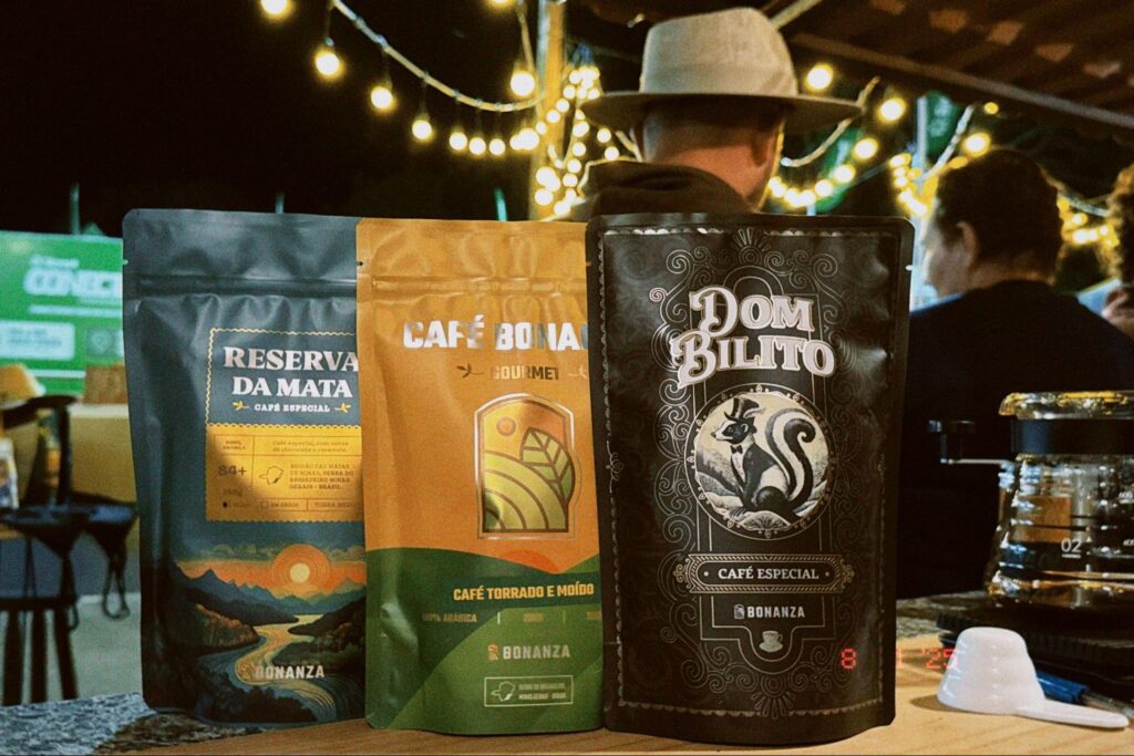 Three Bonanza specialty coffee bags lined up on a table, including the Dom Bilito design