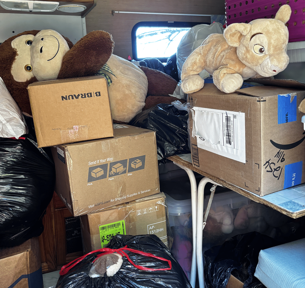 The stuffed animals sitting in a camper