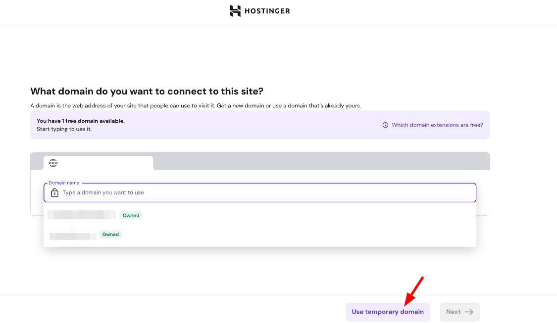 Hostinger domain setup screen with Use temporary domain button highlighted